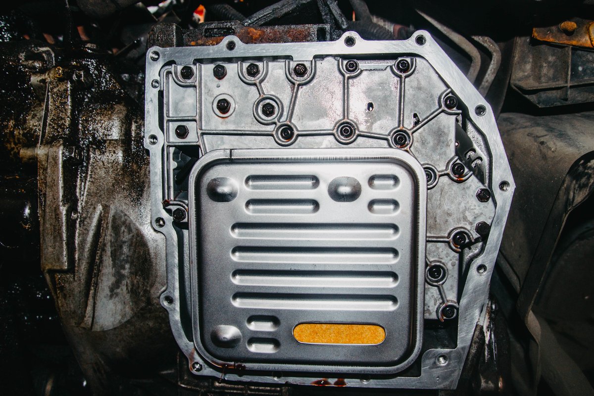 Transmission pan and filter exposed during a transmission fluid service